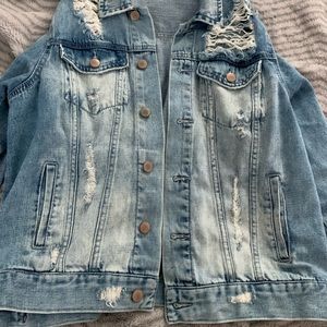Ripped blue Jean jacket. Size M